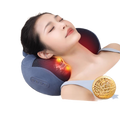 Kneading the shoulder and neck massage pillow and applying hot compress
